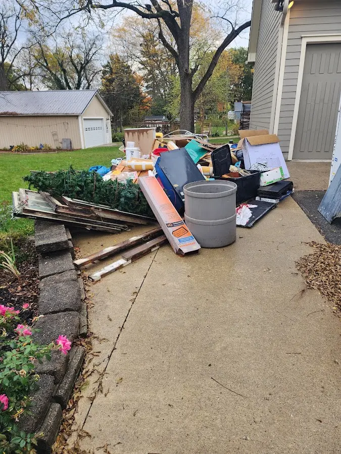 Dumpster being loaded with debris for Commercial Dumpster Rental in Arnold